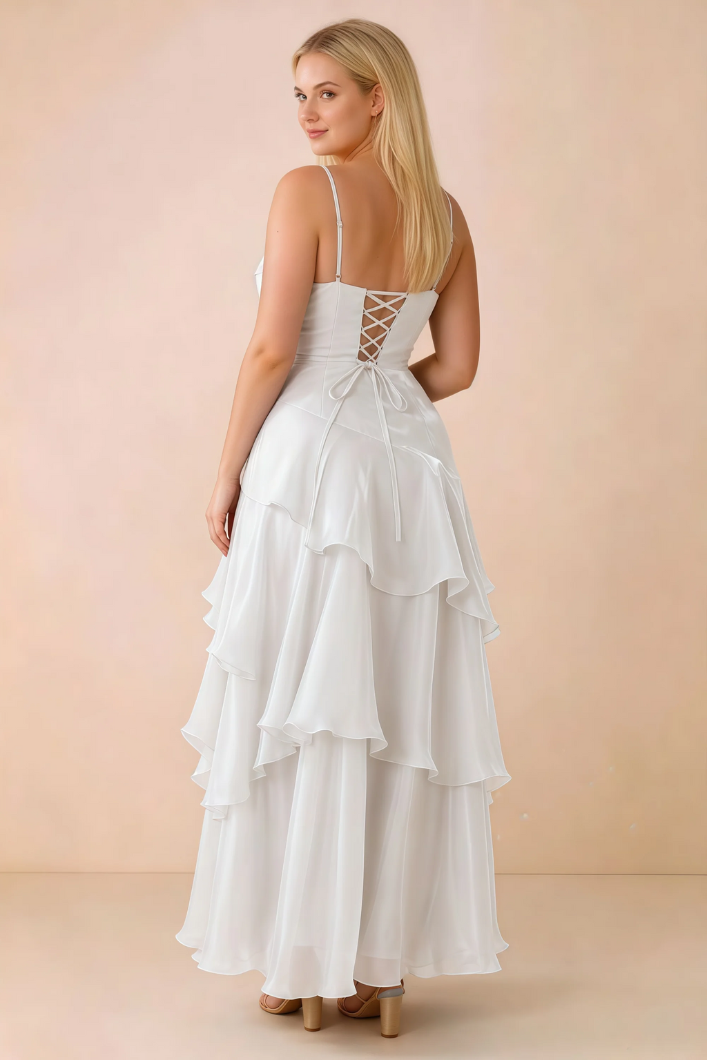 Rear studio view of Ava white maxi dress showing the lace-up bodice and long tiered skirt