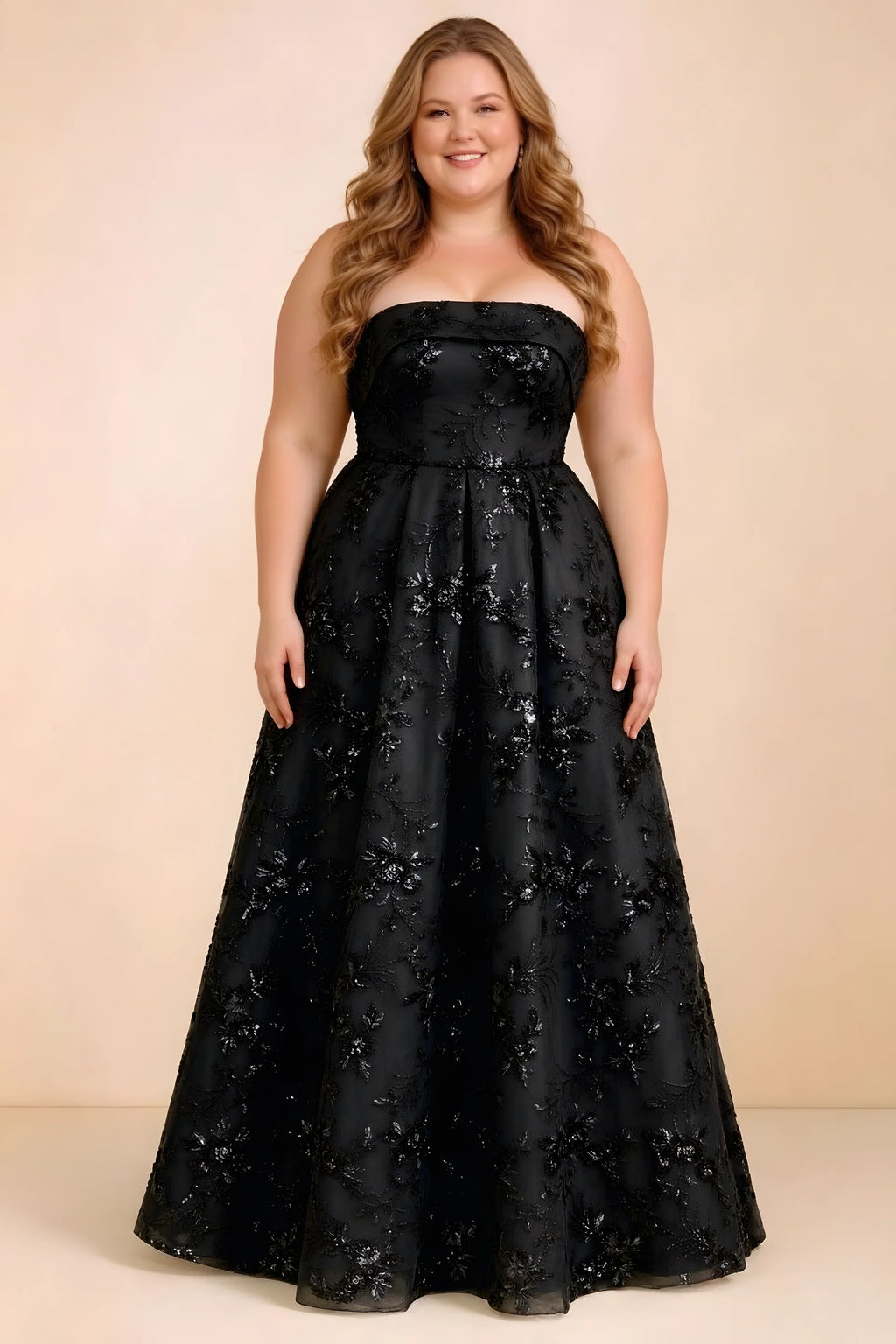 Front studio view of Avis black strapless sequin dress with a defined waist and full skirt