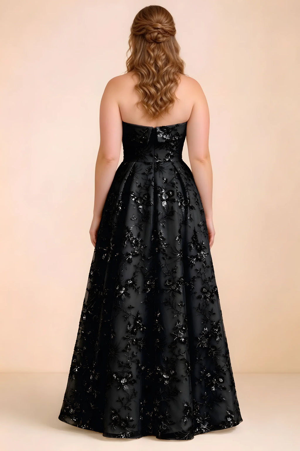 Rear studio view of Avis black floral sequin dress showing the bodice and flowing A-line hem