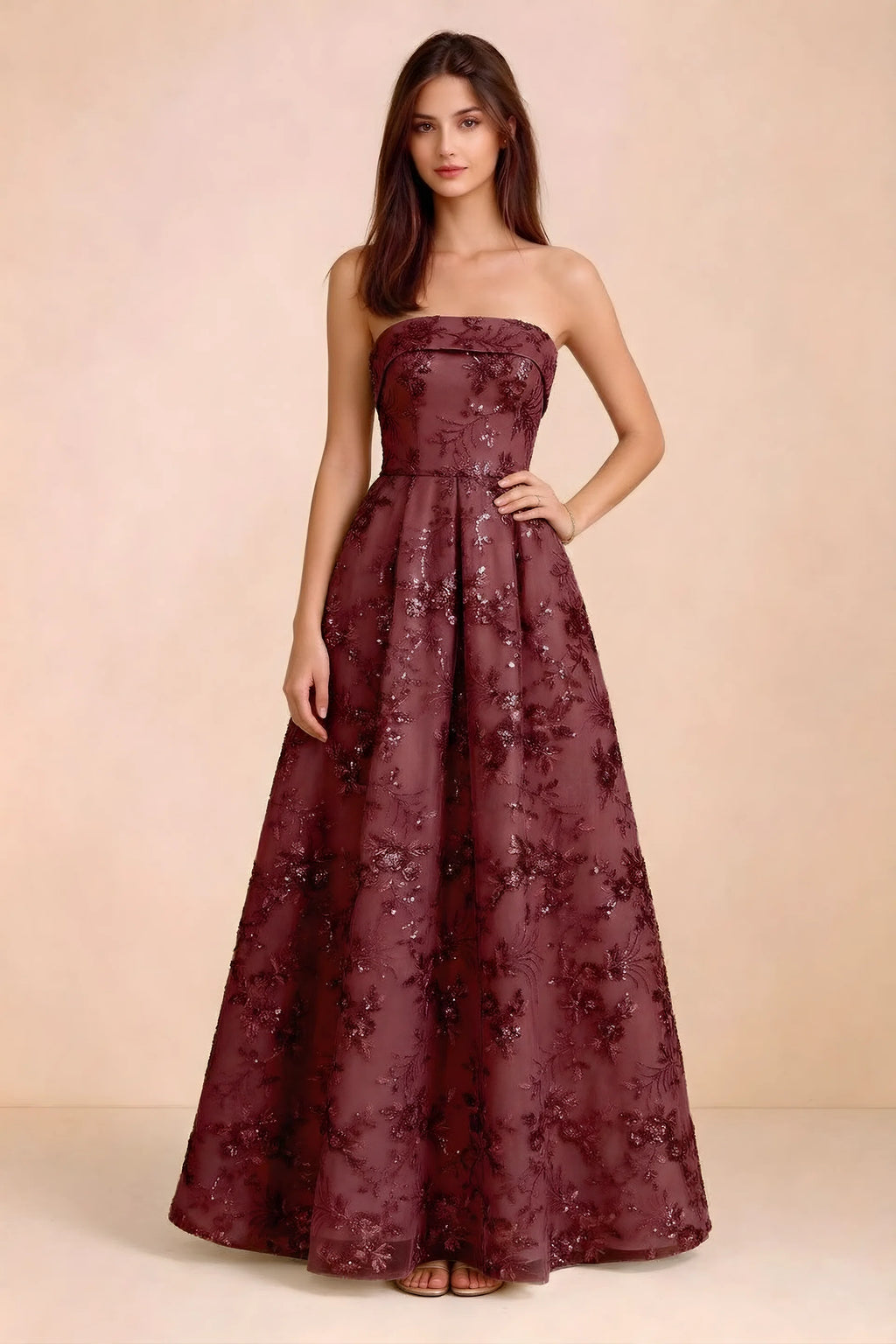 Front view of Avis burgundy floral sequin strapless maxi dress with a fitted waist and full A-line skirt