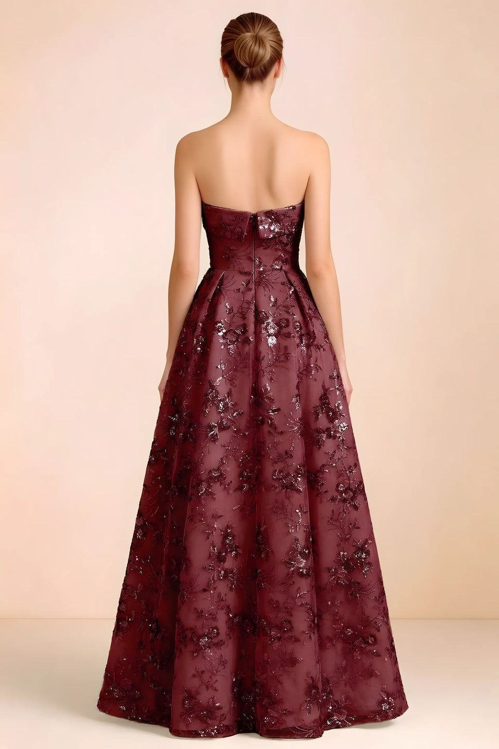 Back view of Avis burgundy strapless sequin dress showing the fitted bodice and floor-length skirt