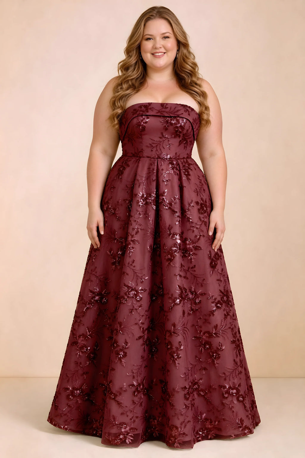 Front studio view of Avis burgundy strapless sequin dress with a defined waist and full skirt