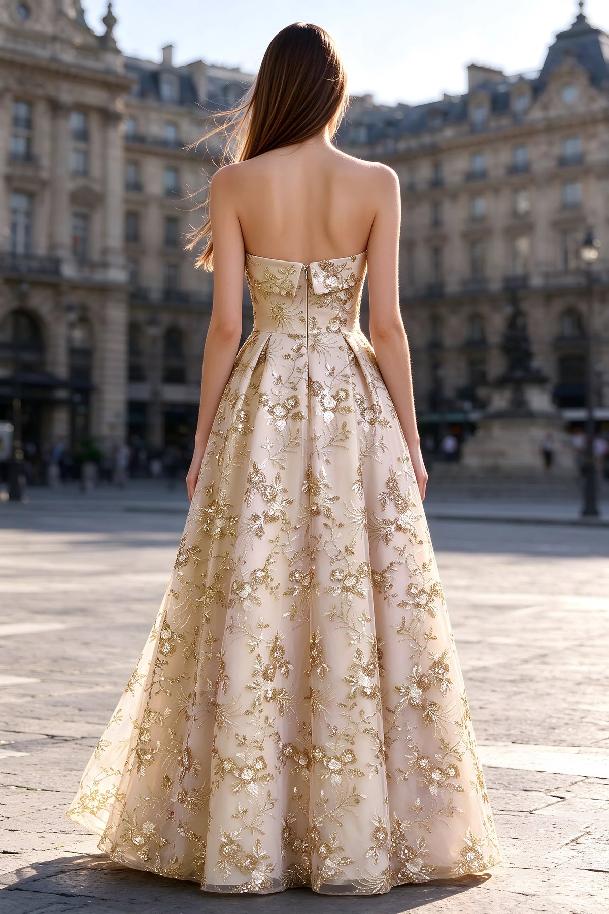 Rear courtyard view of Avis champagne strapless maxi dress and wide pleated skirt