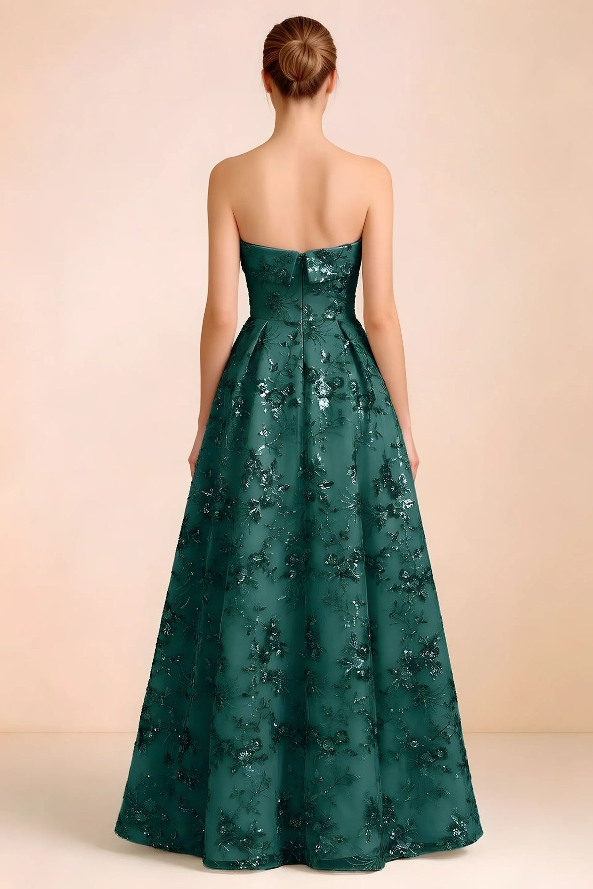Back view of Avis emerald green strapless sequin dress showing the fitted bodice and floor-length skirt