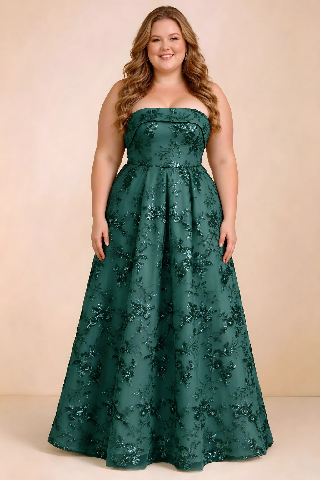 Front studio view of Avis emerald green strapless sequin dress with a defined waist and full skirt