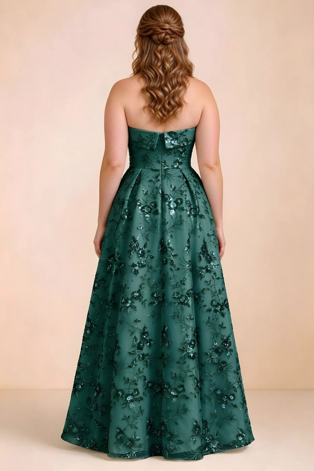 Rear studio view of Avis emerald green floral sequin dress showing the bodice and flowing A-line hem