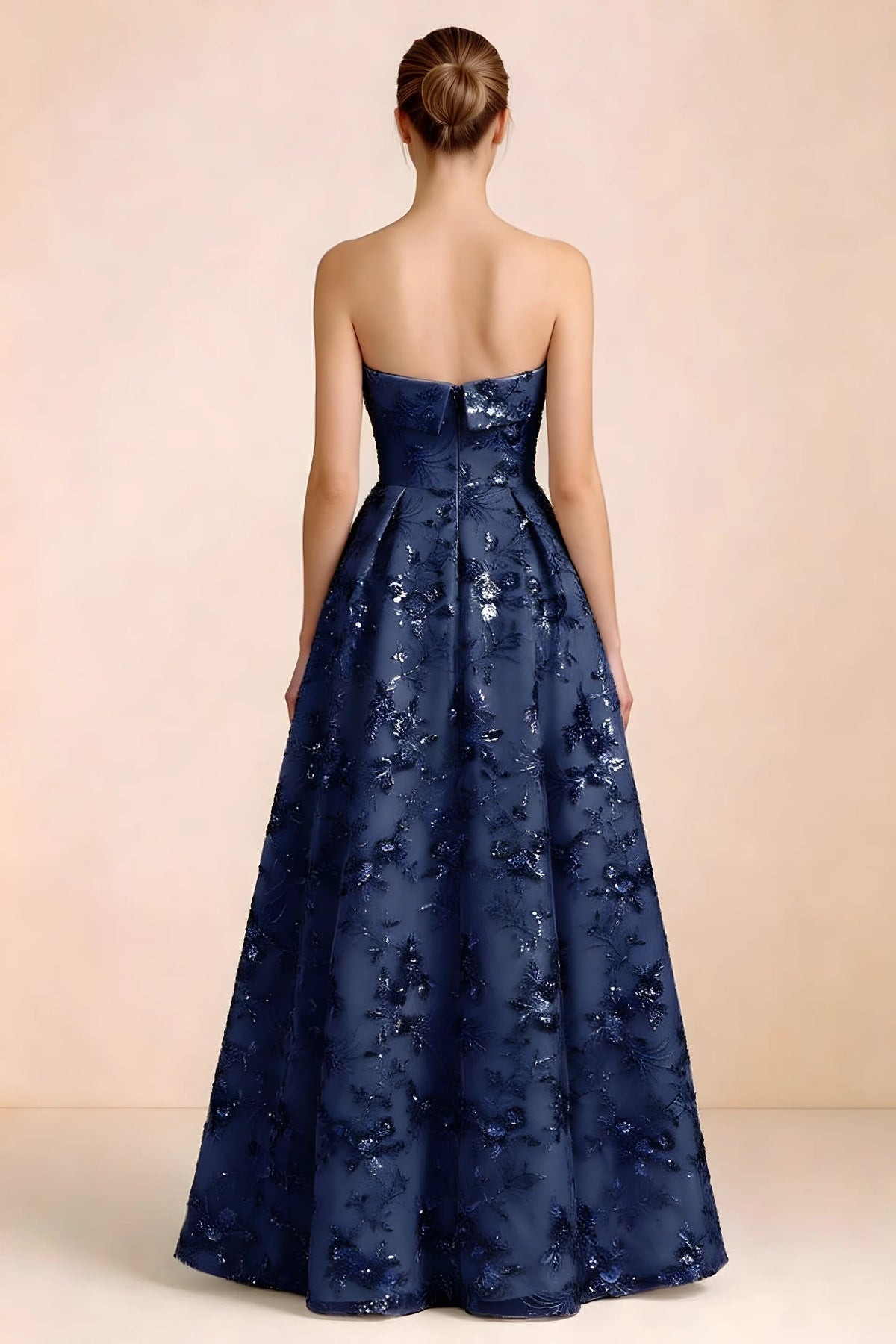 Back view of Avis navy strapless sequin dress showing the fitted bodice and floor-length skirt