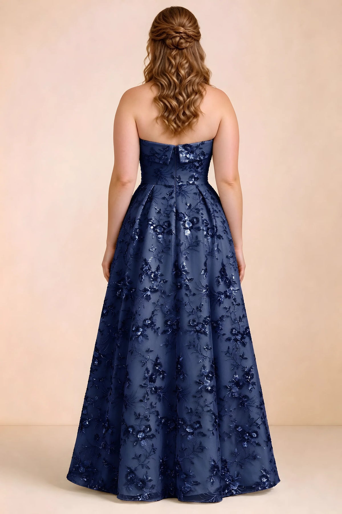 Rear studio view of Avis navy floral sequin dress showing the bodice and flowing A-line hem