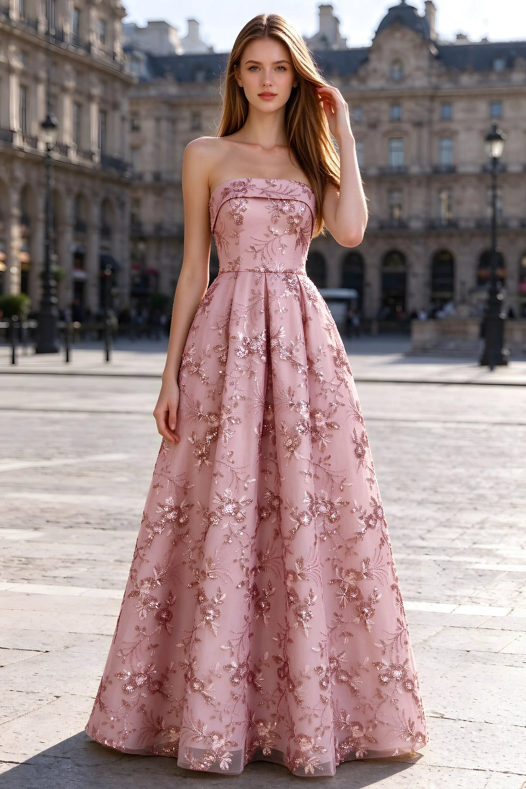 Avis pink floral sequin A-line maxi dress shown from the front in a stone courtyard