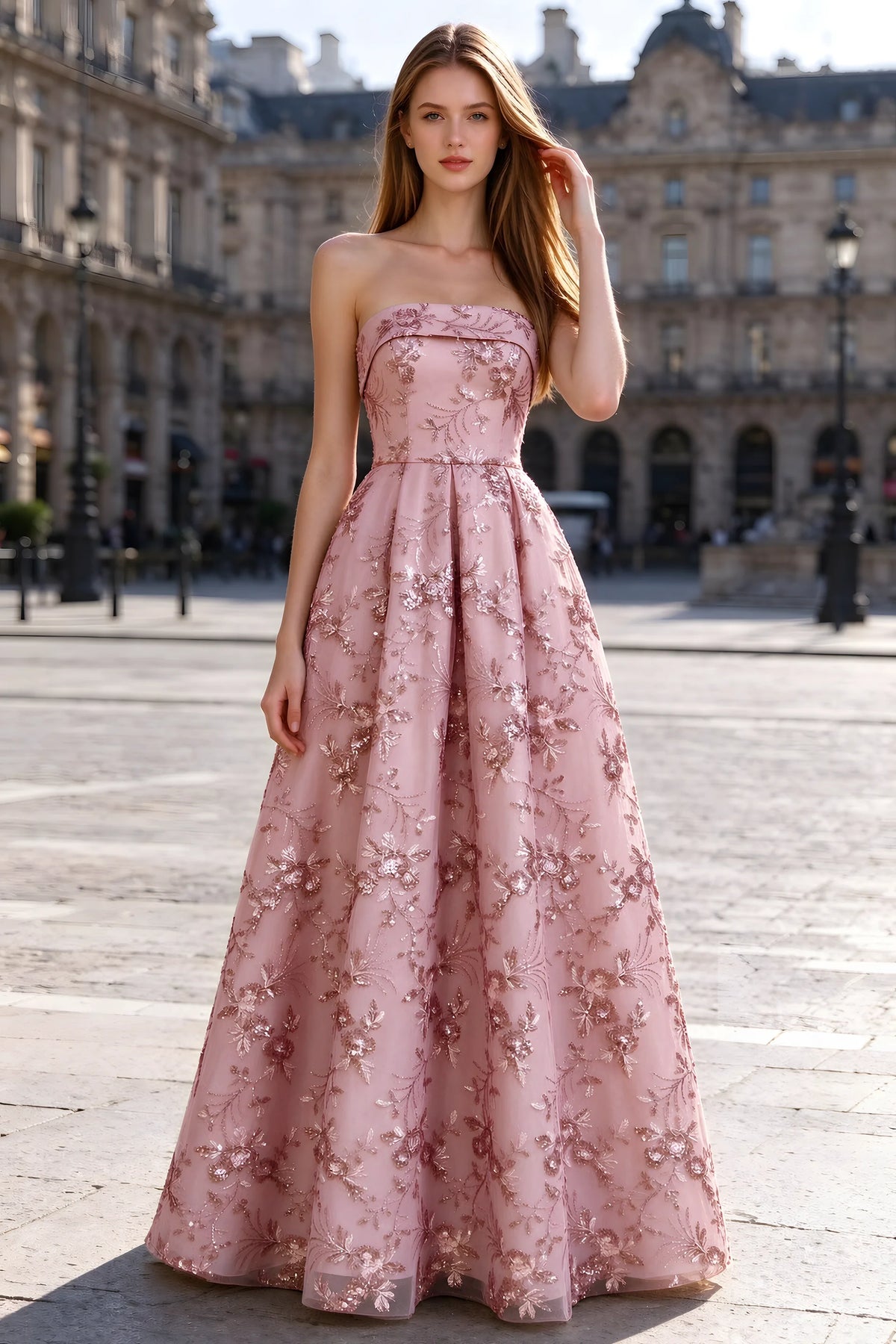 Avis pink floral sequin A-line maxi dress shown from the front in a stone courtyard