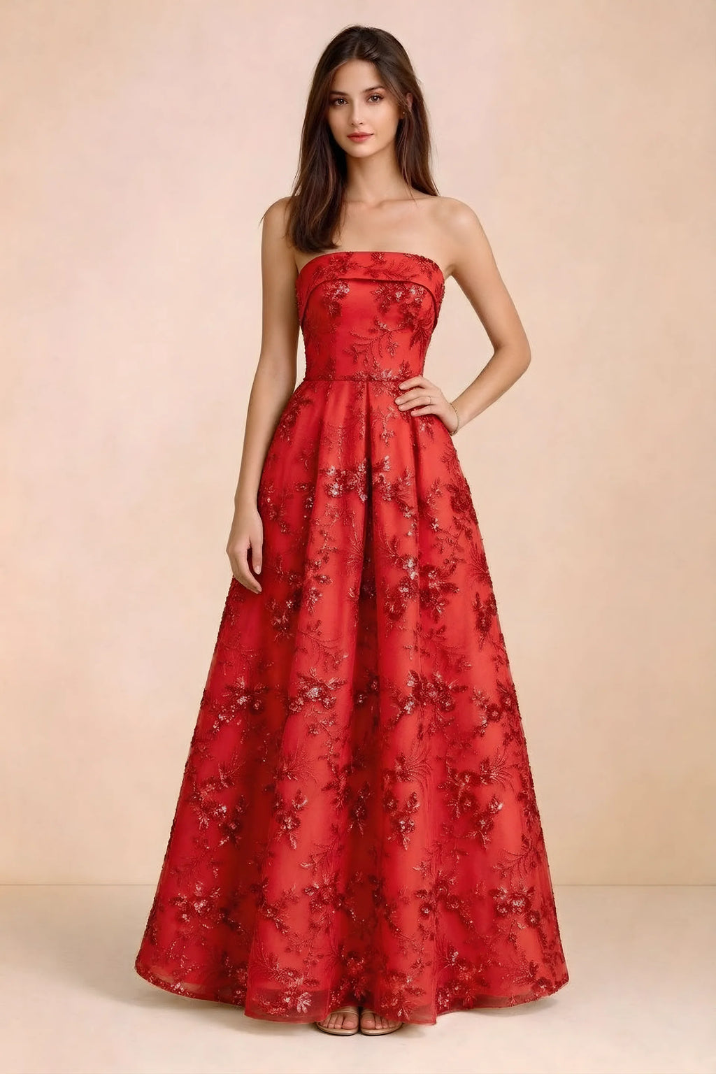 Front view of Avis red floral sequin strapless maxi dress with a fitted waist and full A-line skirt