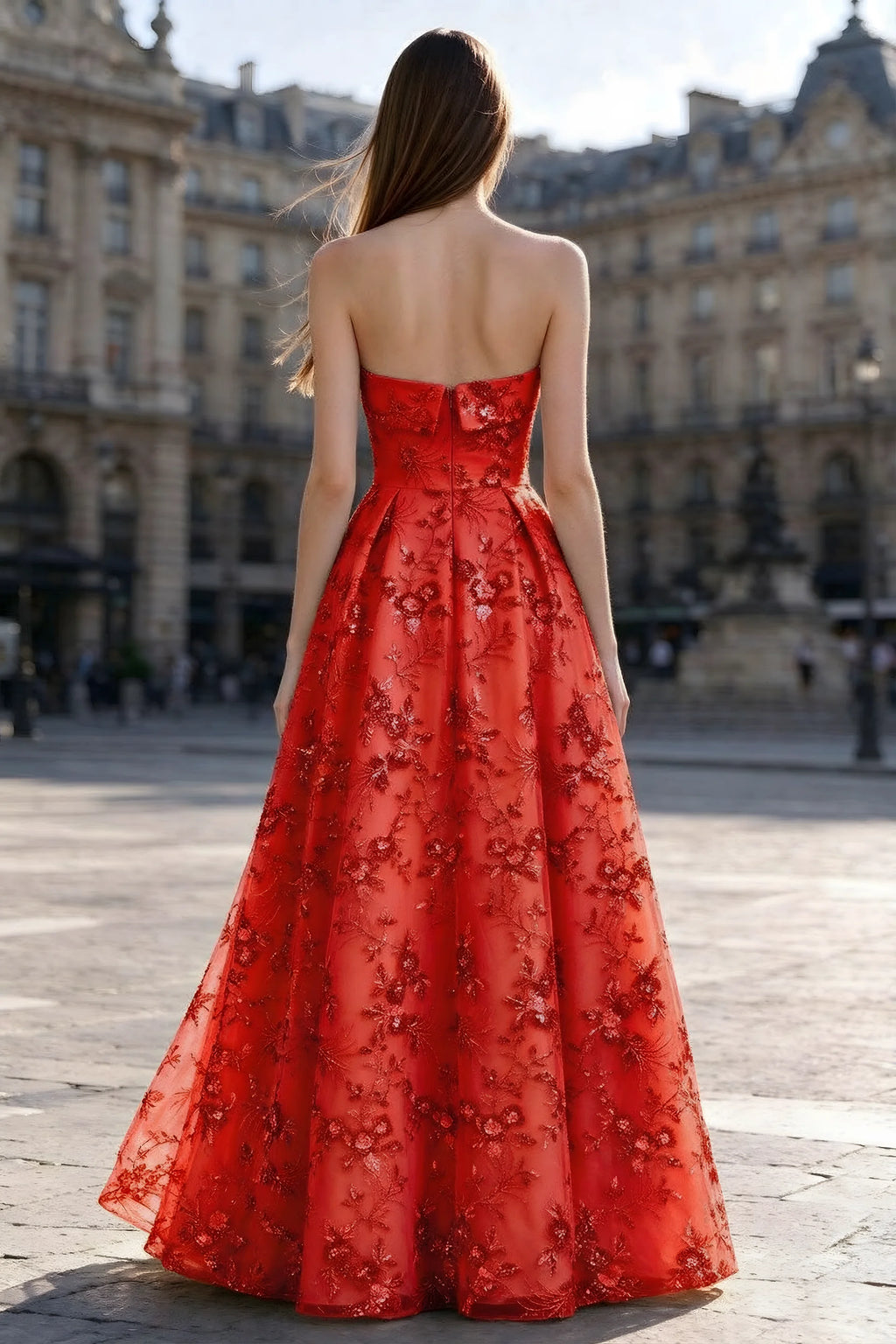 Rear courtyard view of Avis red strapless maxi dress and wide pleated skirt