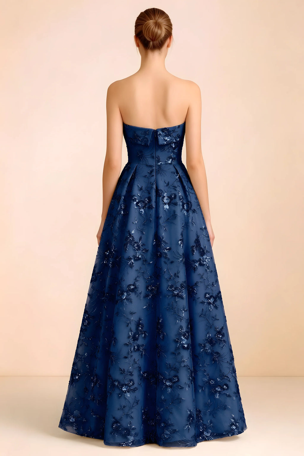 Back view of Avis royal blue strapless sequin dress showing the fitted bodice and floor-length skirt