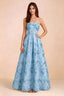 Front view of Avis sky blue floral sequin strapless maxi dress with a fitted waist and full A-line skirt