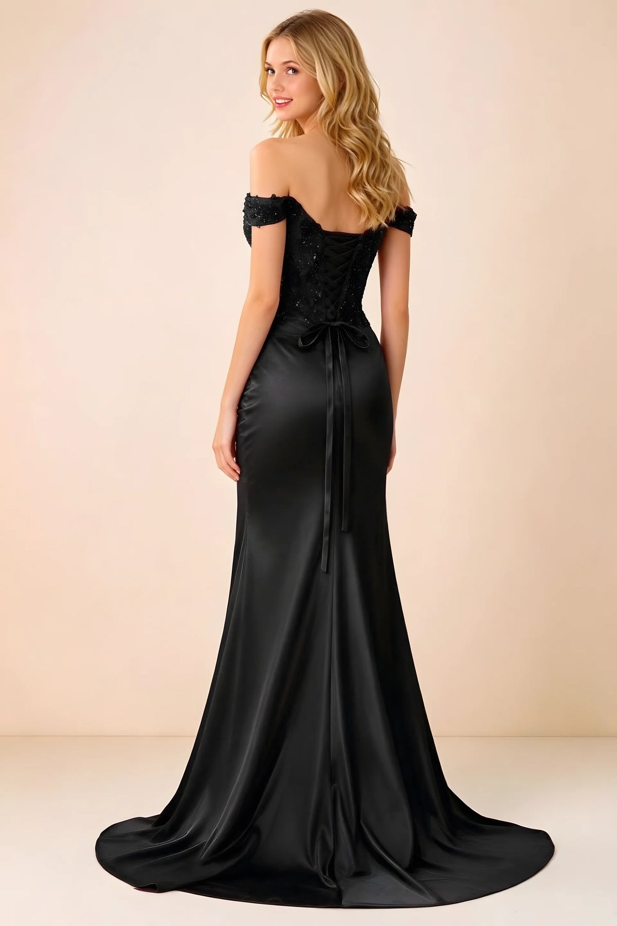Back view of Beatrix black maxi dress showing the lace-up bodice and sweeping mermaid hem