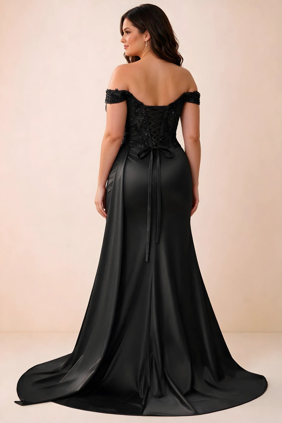 Rear studio view of Beatrix black satin maxi dress showing the back ties and mermaid silhouette