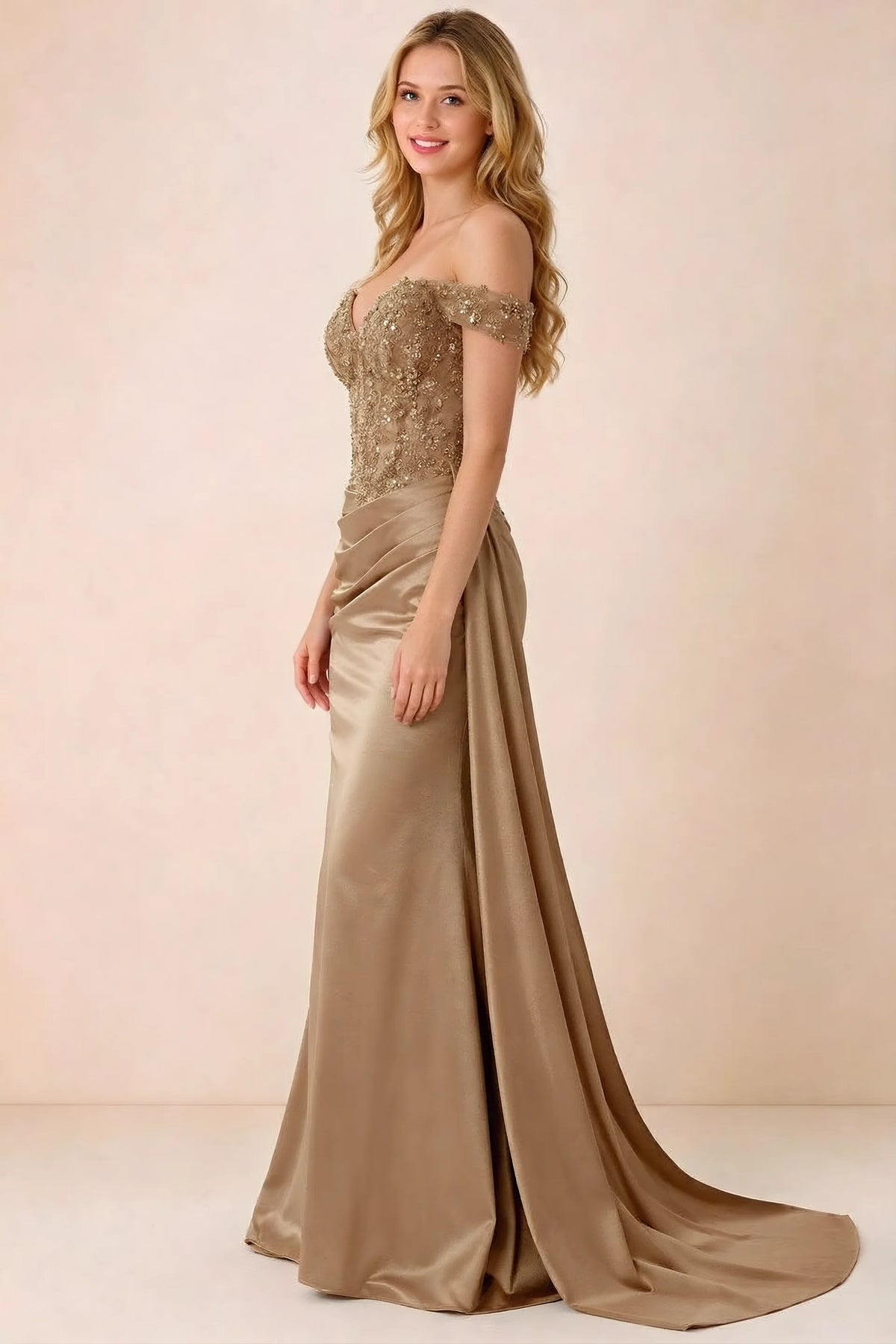 Side view of Beatrix champagne maxi dress showing the fitted hips and draped skirt