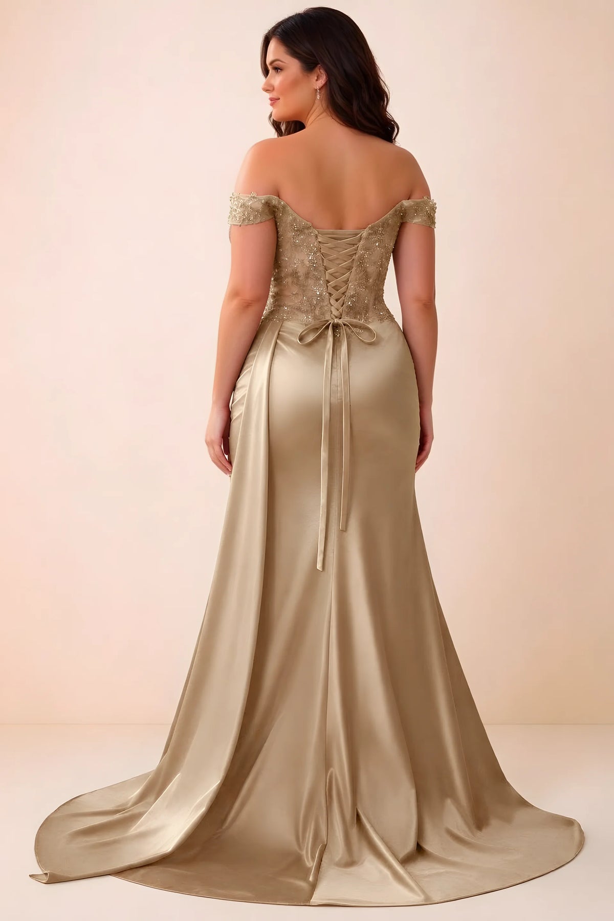 Rear studio view of Beatrix champagne satin maxi dress showing the back ties and mermaid silhouette