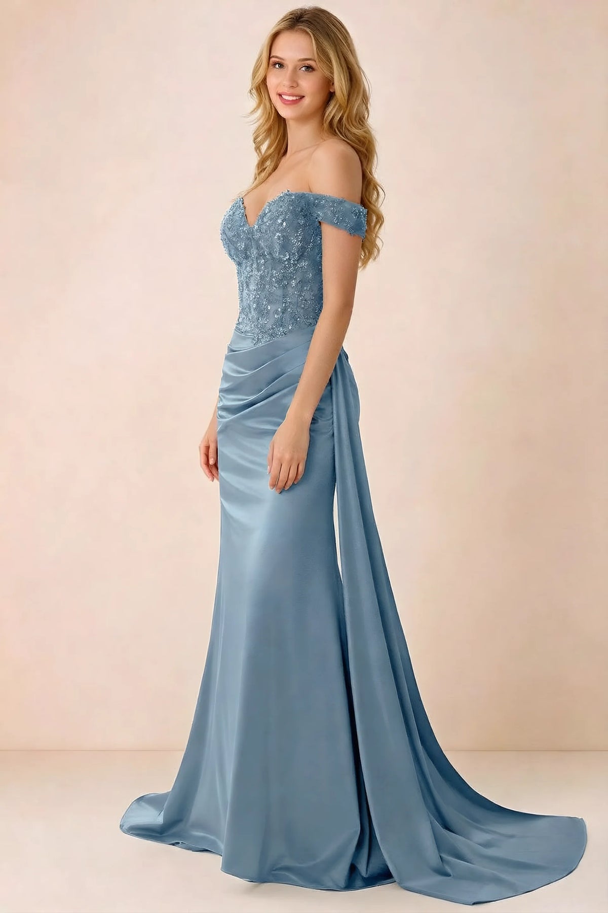 Side view of Beatrix dusty blue maxi dress showing the fitted hips and draped skirt