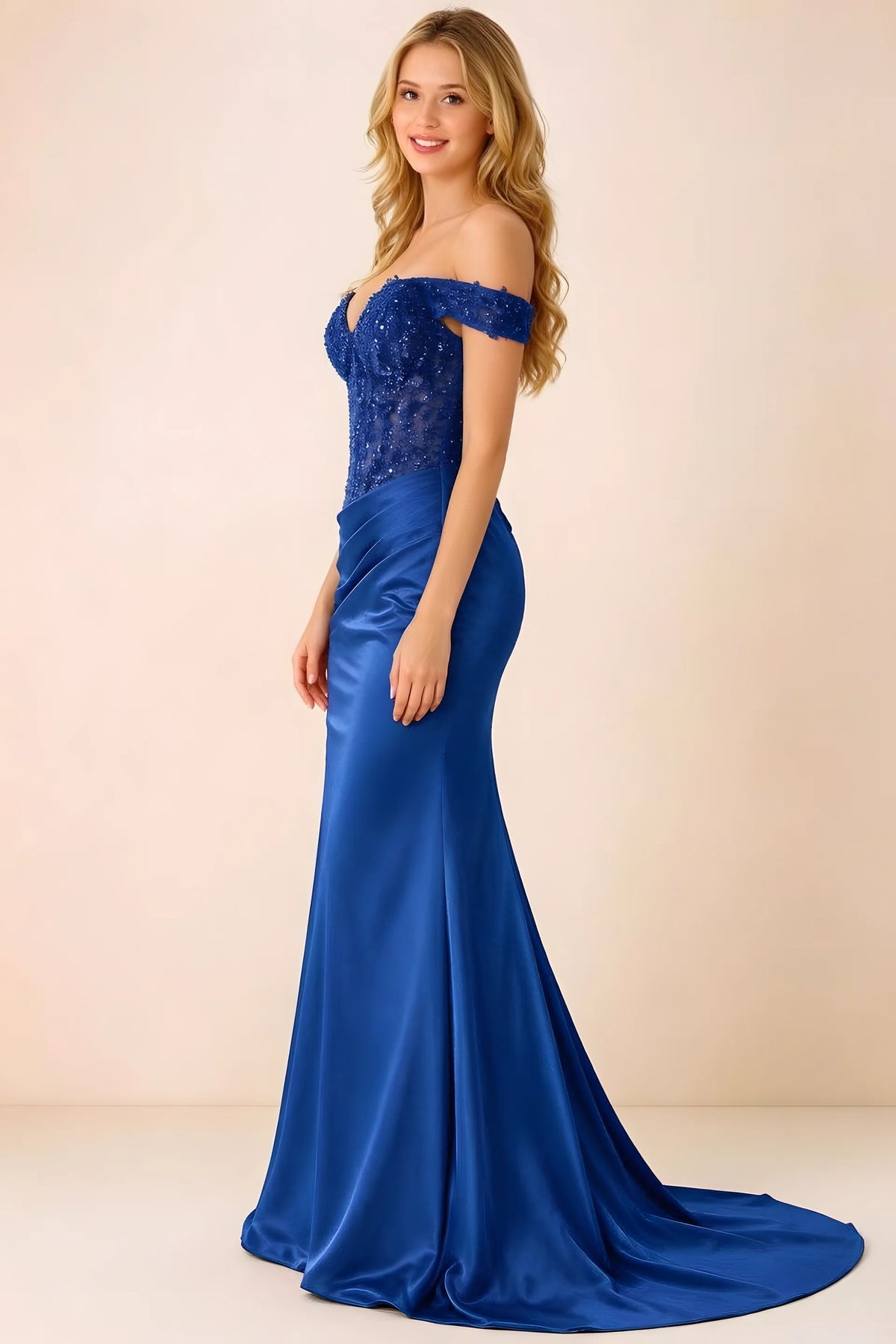 Side view of Beatrix navy maxi dress showing the fitted hips and draped skirt