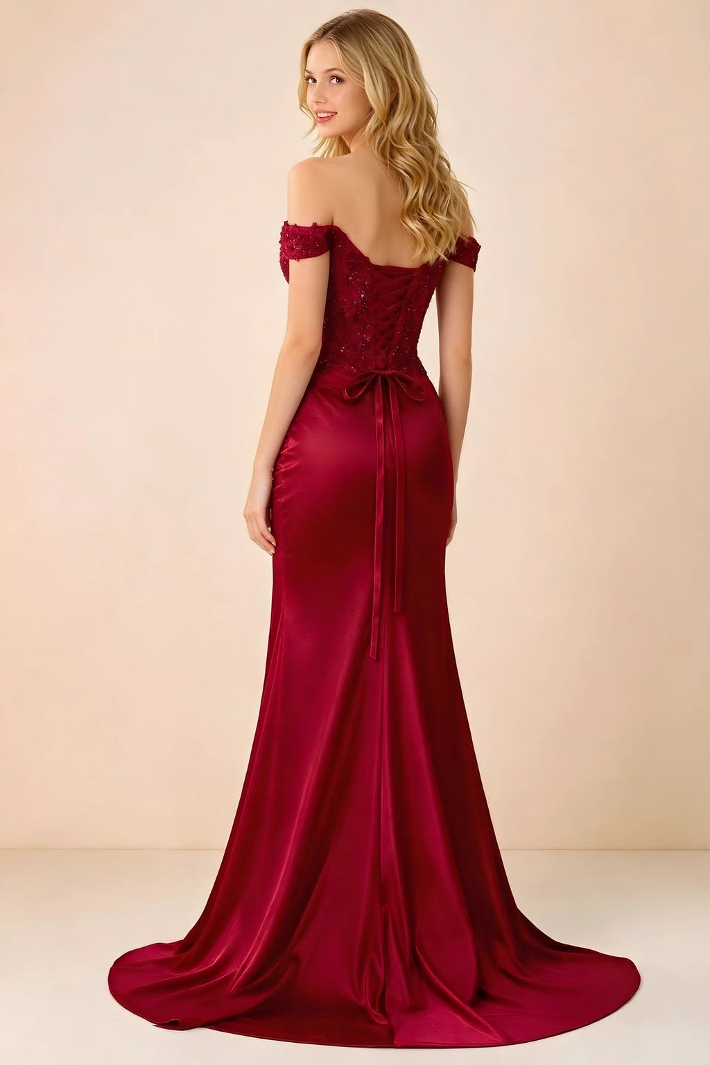 Back view of Beatrix red maxi dress showing the lace-up bodice and sweeping mermaid hem