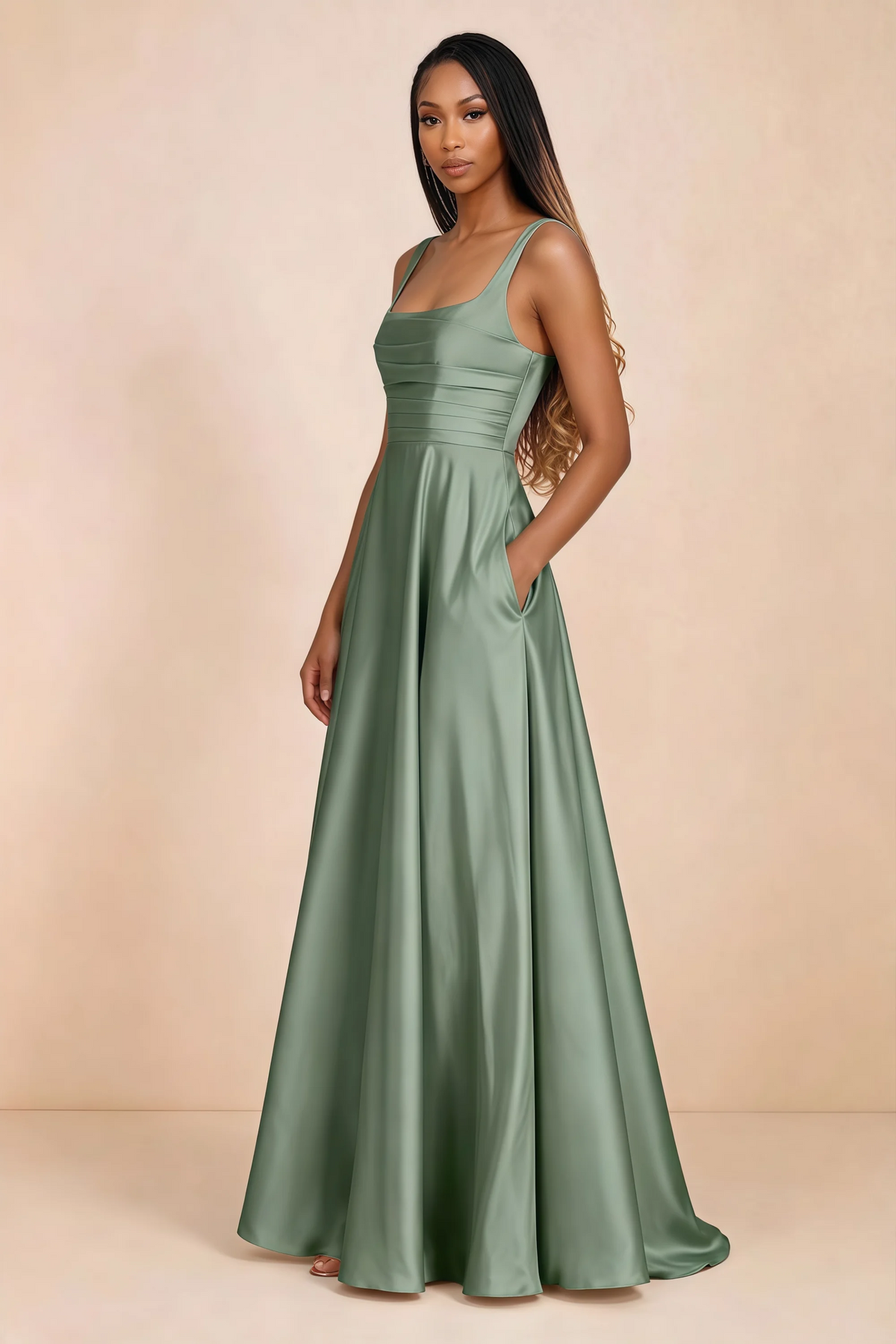 Three-quarter studio view of Becky aloe green satin maxi dress with a hand resting in the side pocket