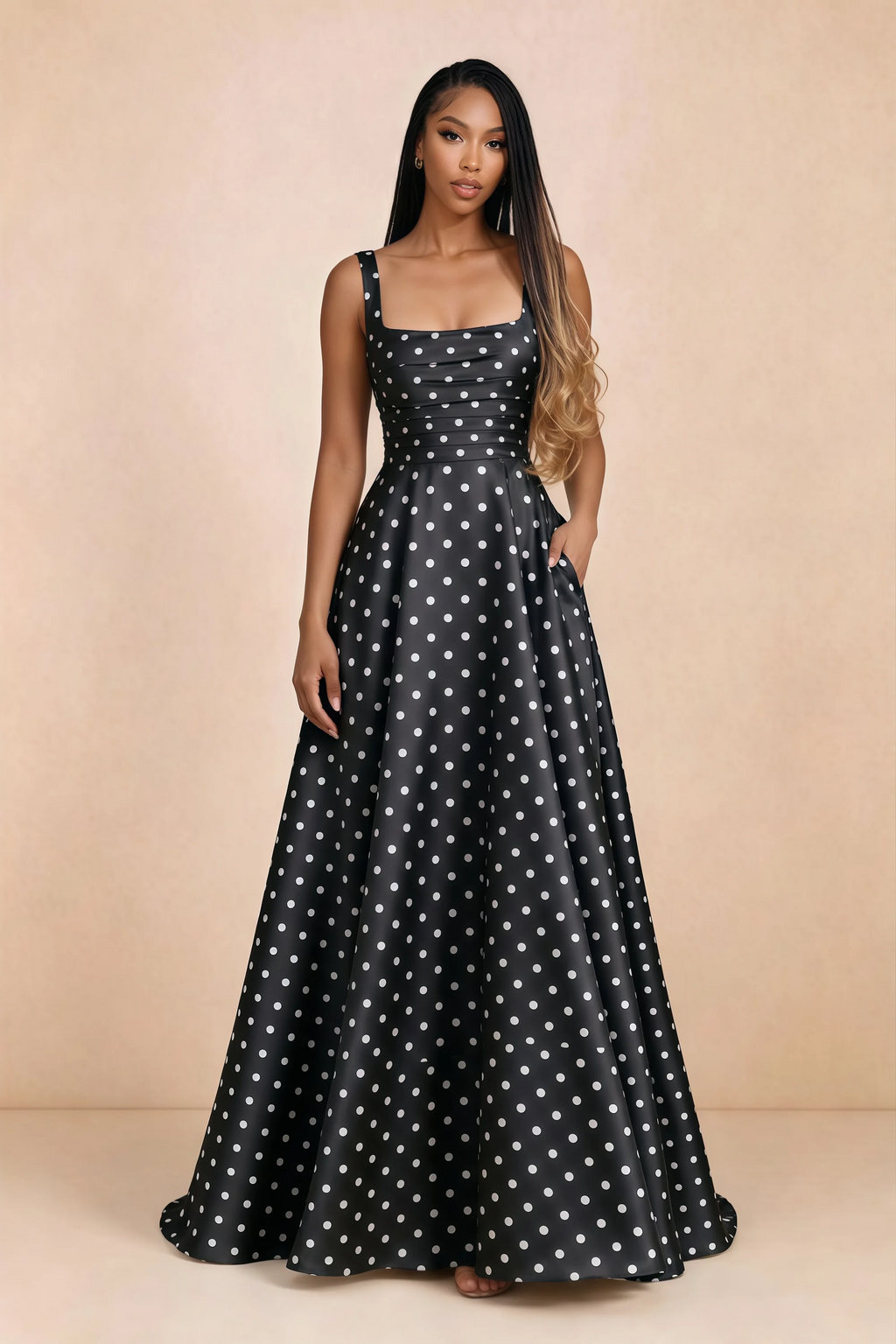 Front studio view of Becky black polka dot satin maxi dress showing the square neckline, pleated bodice and full A-line skirt