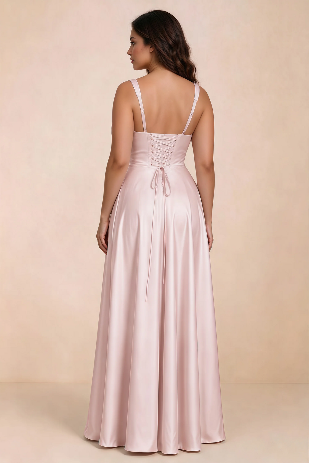 Rear studio view of Becky blush satin maxi dress showing crossed back lacing above the full skirt