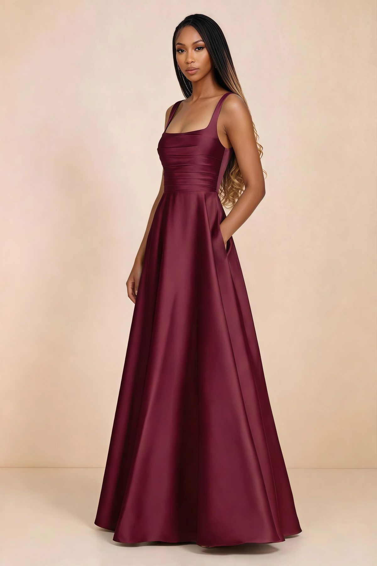 Three-quarter studio view of Becky burgundy satin maxi dress with a hand resting in the side pocket