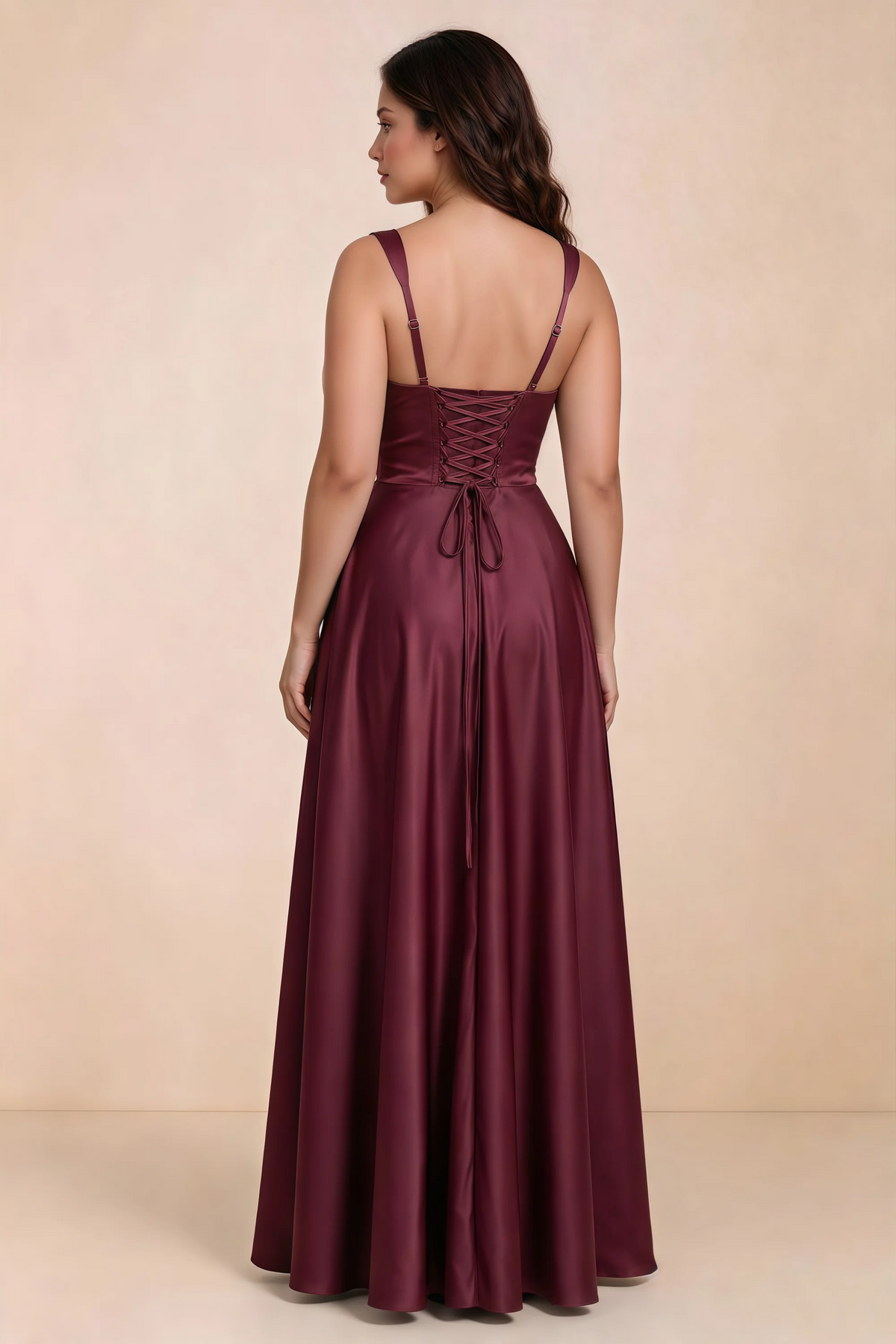 Rear studio view of Becky burgundy satin maxi dress showing crossed back lacing above the full skirt