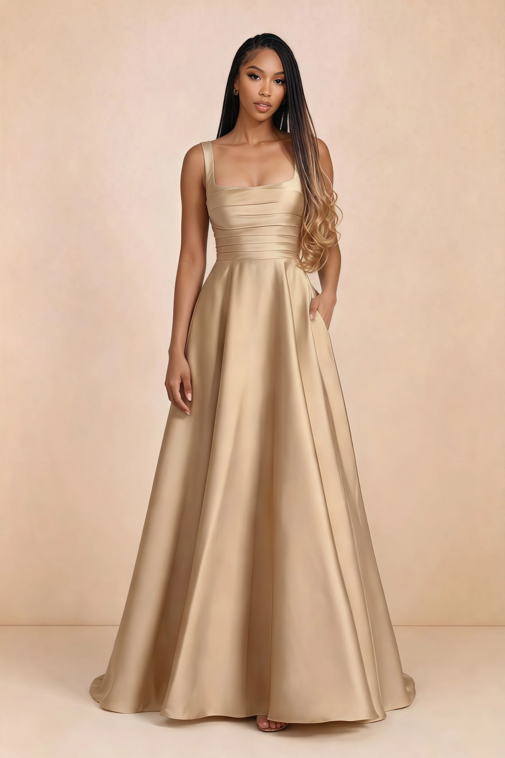 Front studio view of Becky champagne satin maxi dress showing the square neckline, pleated bodice and full A-line skirt