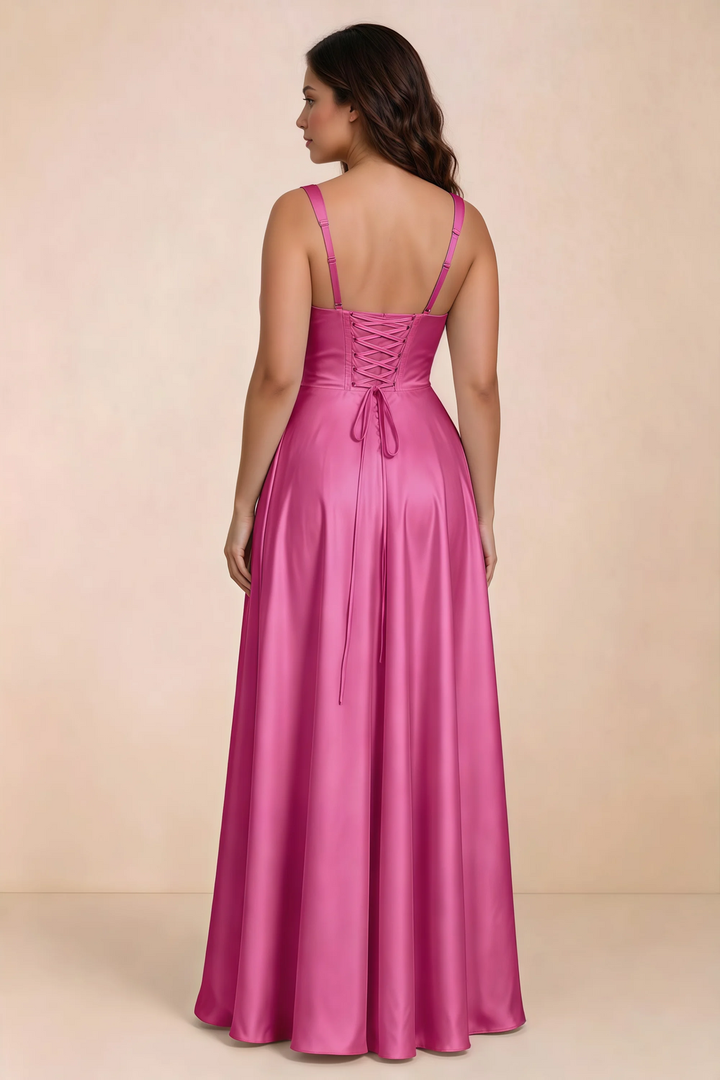 Rear studio view of Becky fuchsia satin maxi dress showing crossed back lacing above the full skirt
