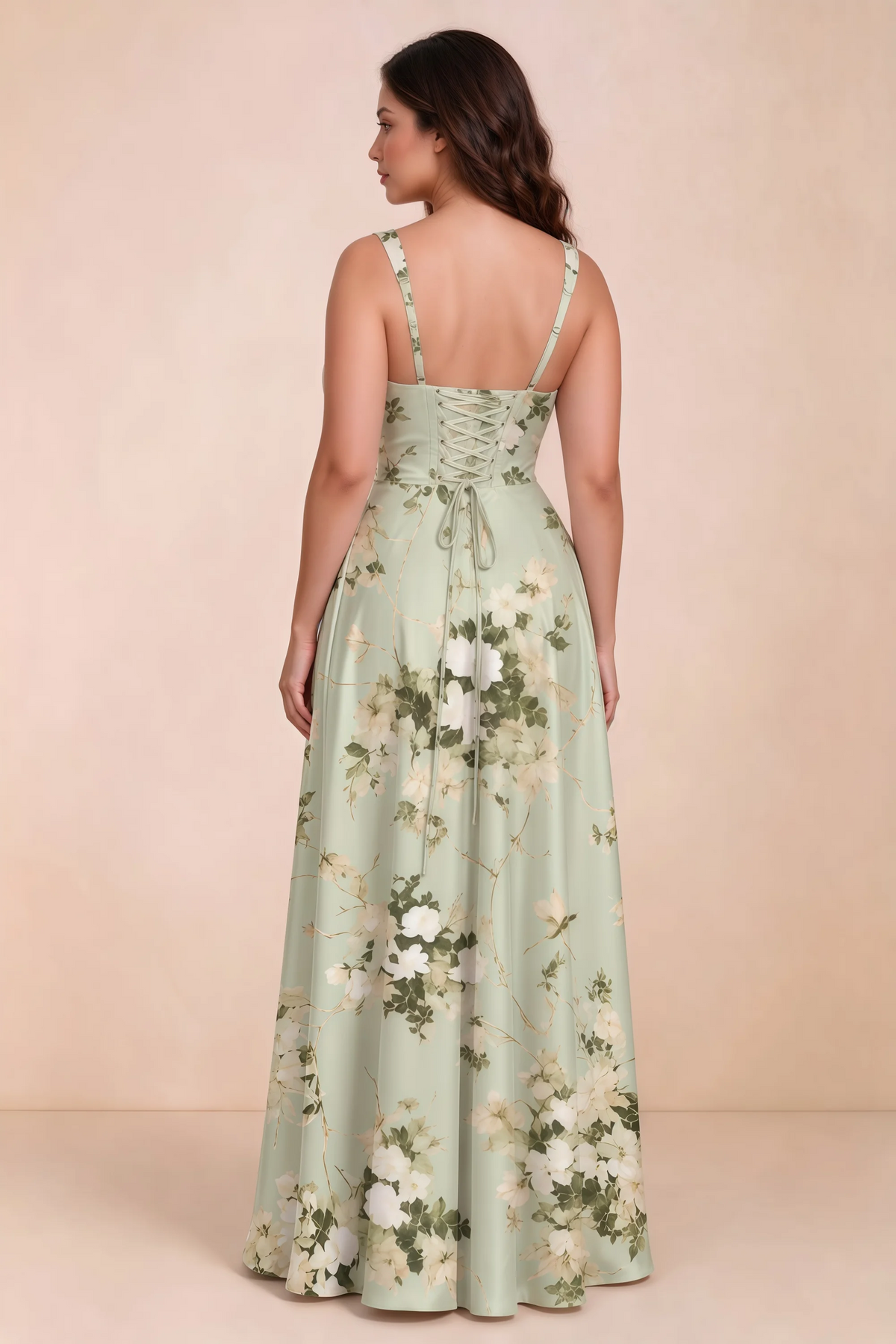 Rear studio view of Becky green floral satin maxi dress showing crossed back lacing above the full skirt