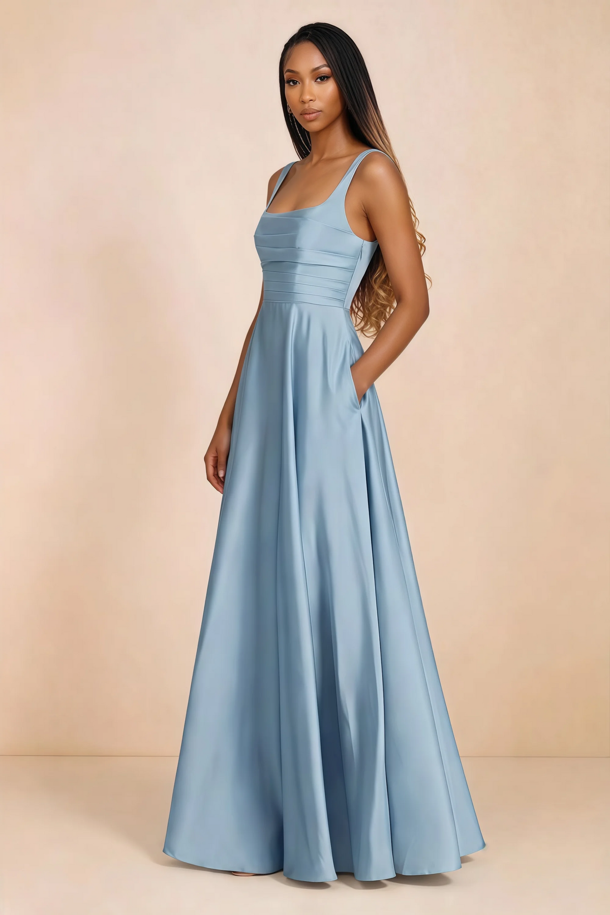Three-quarter studio view of Becky haze blue satin maxi dress with a hand resting in the side pocket