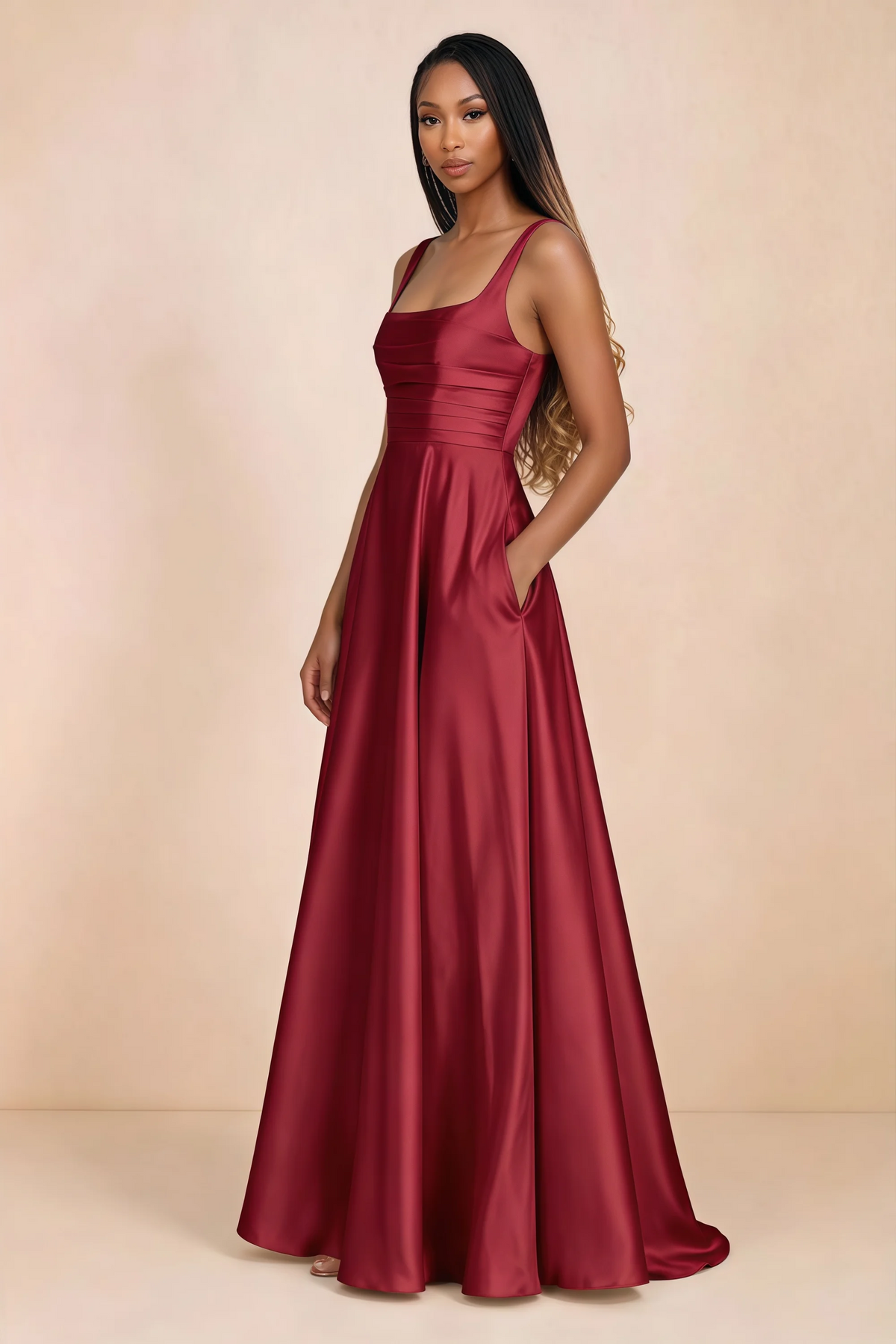 Three-quarter studio view of Becky red satin maxi dress with a hand resting in the side pocket