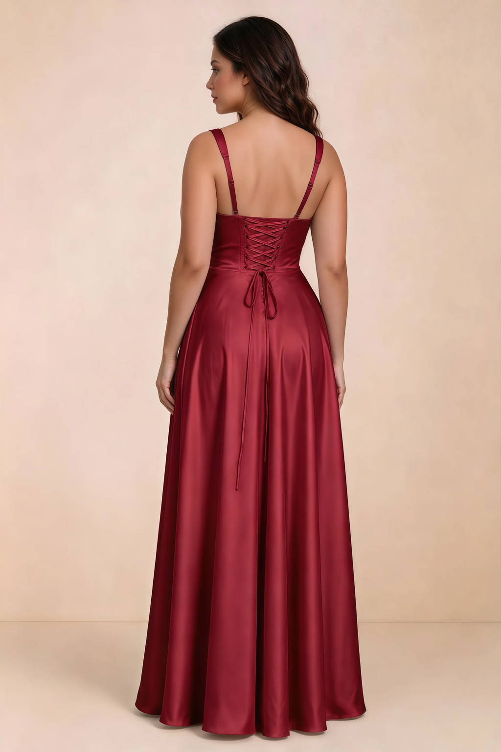 Rear studio view of Becky red satin maxi dress showing crossed back lacing above the full skirt