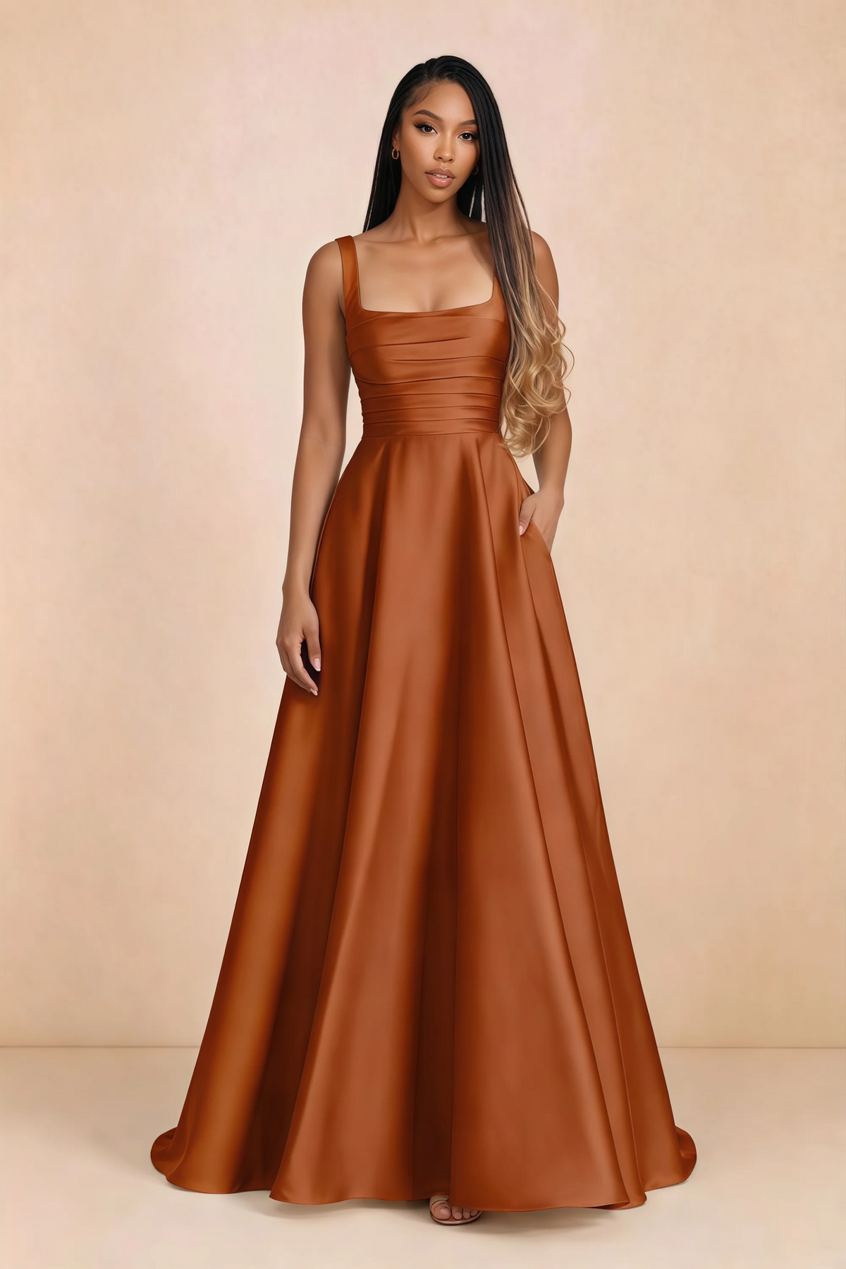 Front studio view of Becky rust satin maxi dress showing the square neckline, pleated bodice and full A-line skirt