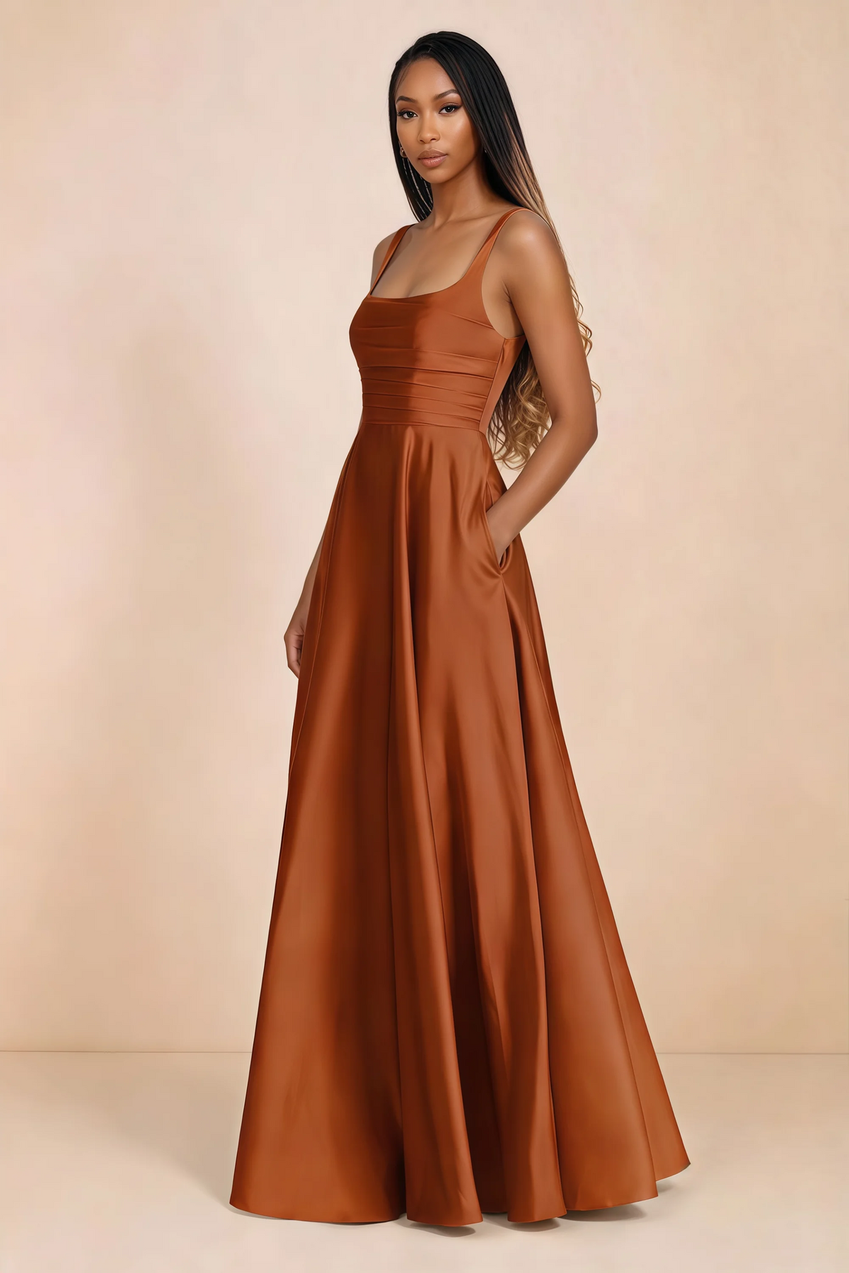 Three-quarter studio view of Becky rust satin maxi dress with a hand resting in the side pocket