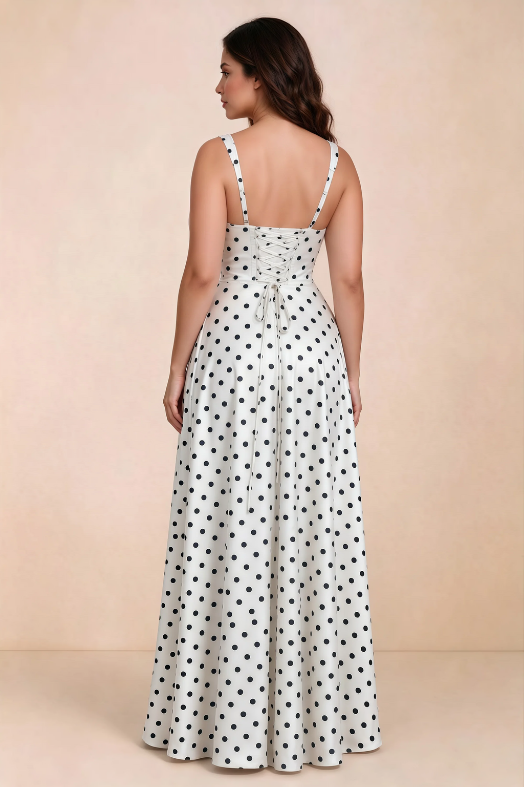 Rear studio view of Becky white polka dot satin maxi dress showing crossed back lacing above the full skirt