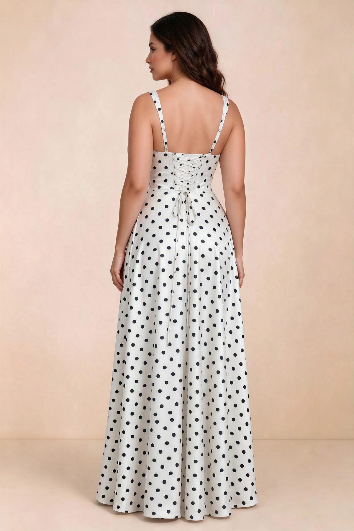 Rear studio view of Becky white polka dot satin maxi dress showing crossed back lacing above the full skirt