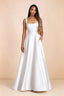 Front studio view of Becky white satin maxi dress showing the square neckline, pleated bodice and full A-line skirt