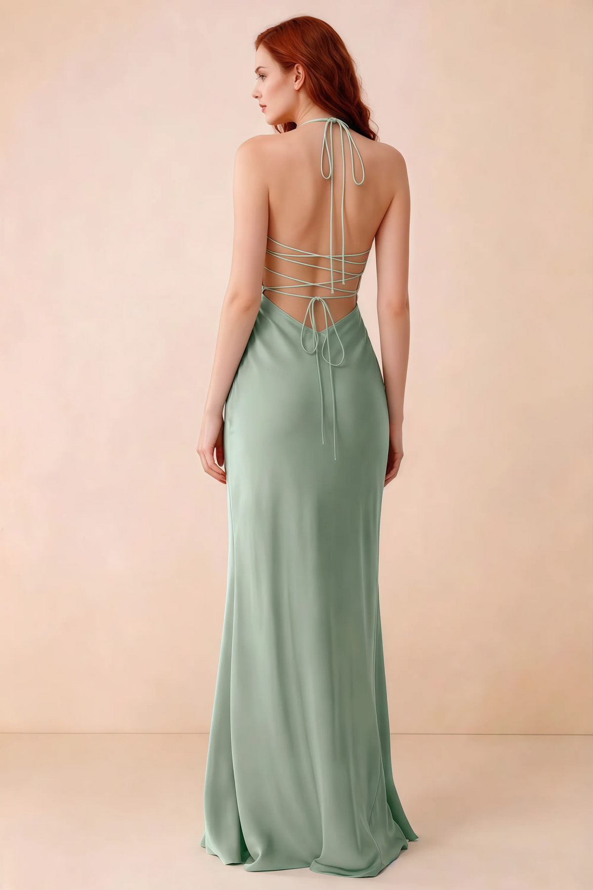 Back studio view of Blanche agave dress showing halter neck ties and crossed open-back lacing