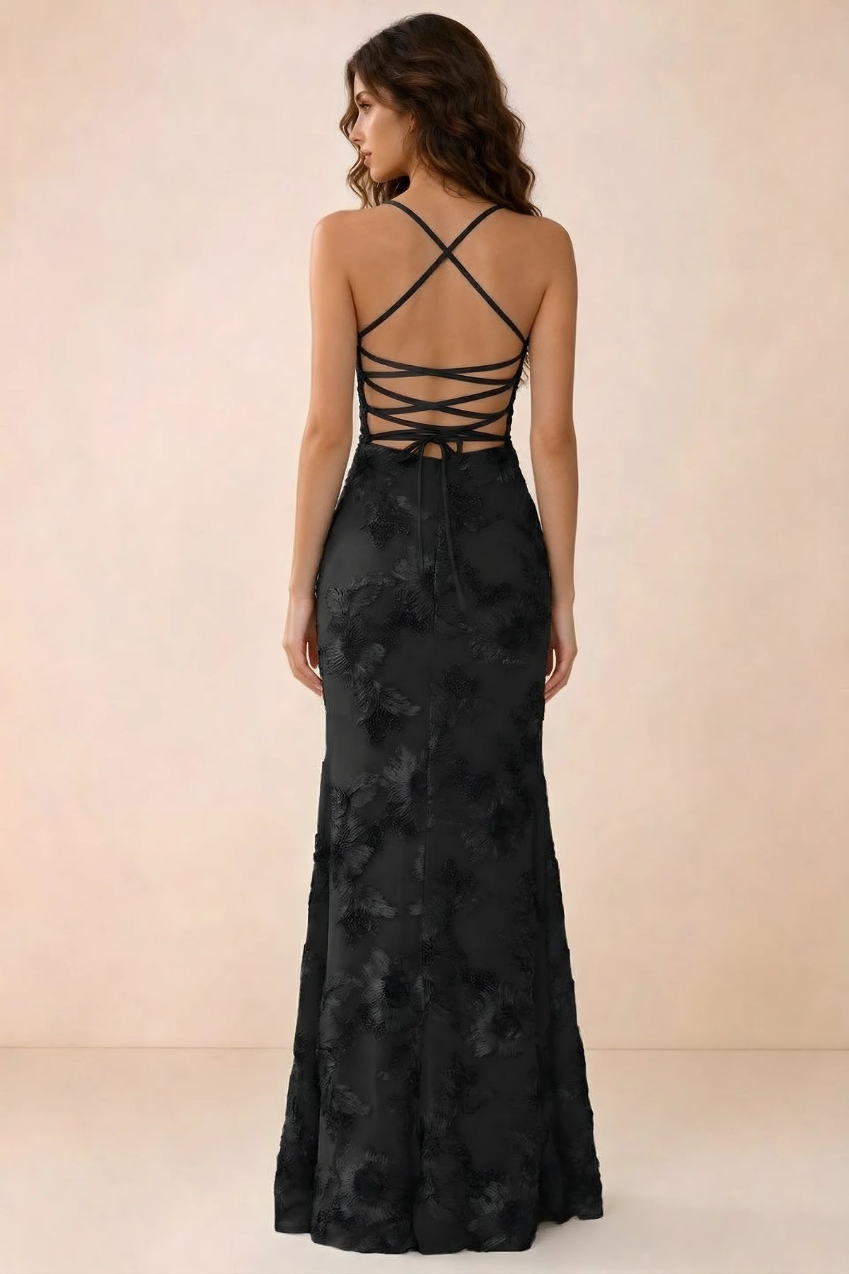 Back studio view of Belinda black maxi dress showing crossed straps and open-back ties