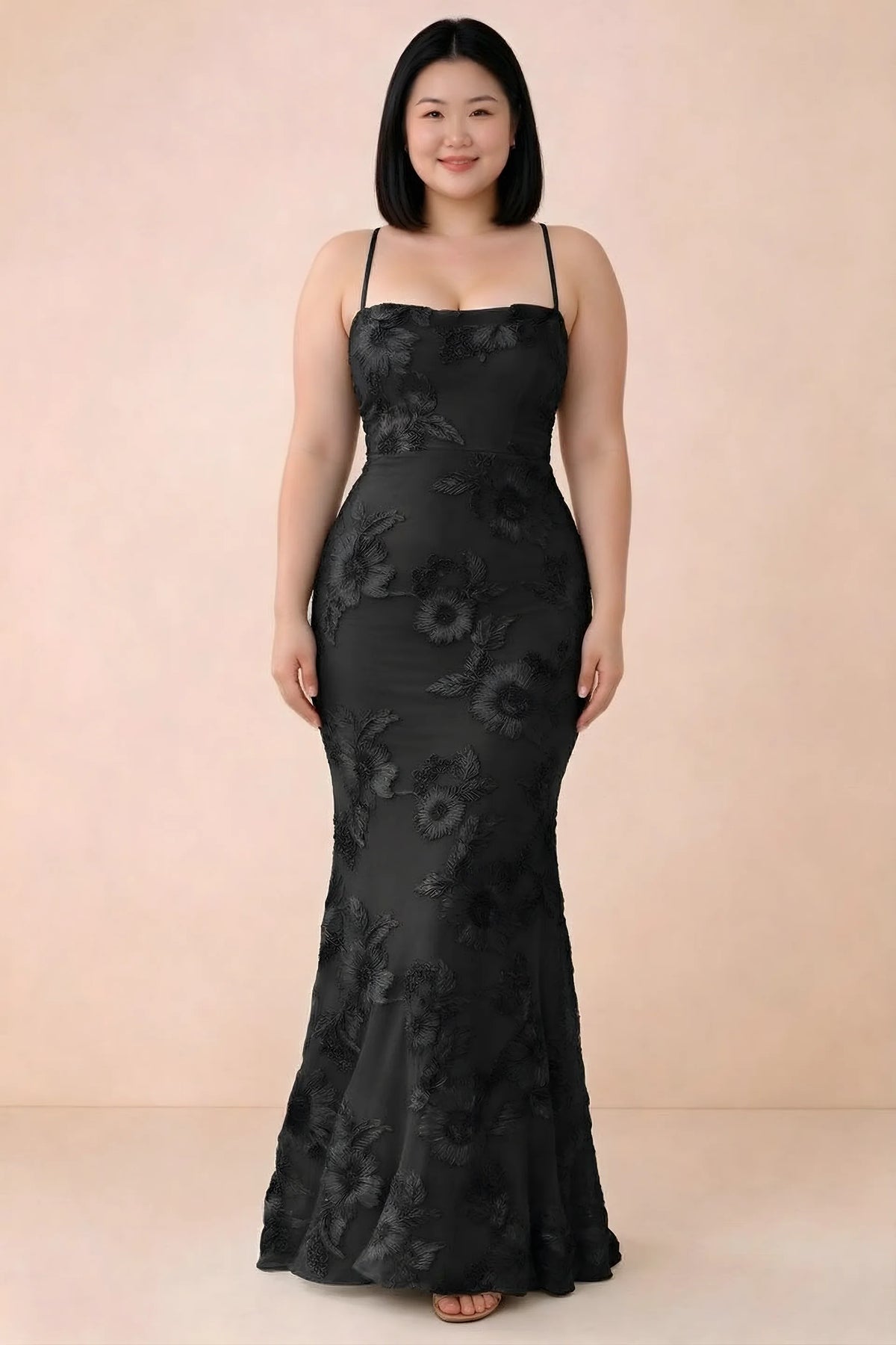 Front studio view of Belinda black floral maxi dress showing the close-fitting bodice and long skirt