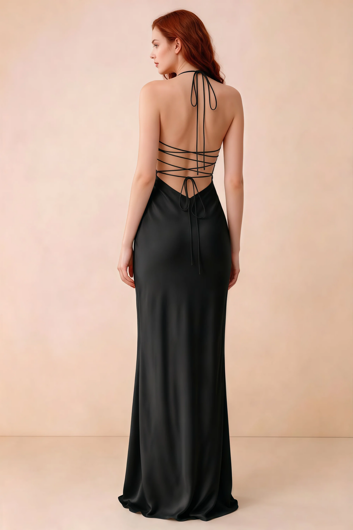 Back studio view of Blanche black dress showing halter neck ties and crossed open-back lacing