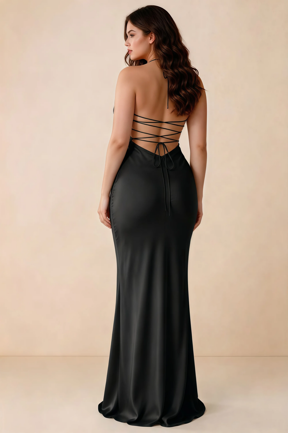 Rear studio view of Blanche black satin dress showing the open back and mermaid silhouette