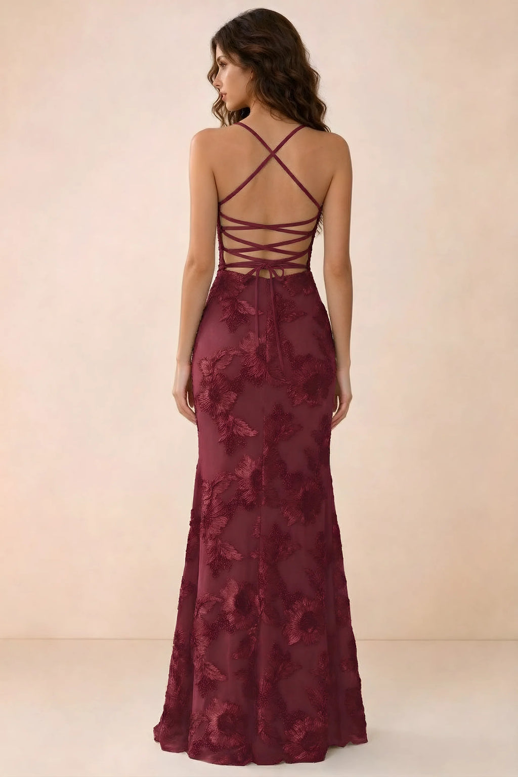 Back studio view of Belinda burgundy maxi dress showing crossed straps and open-back ties