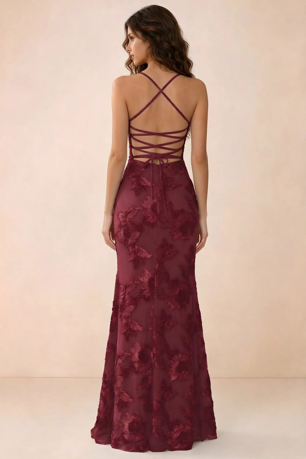 Back studio view of Belinda burgundy maxi dress showing crossed straps and open-back ties