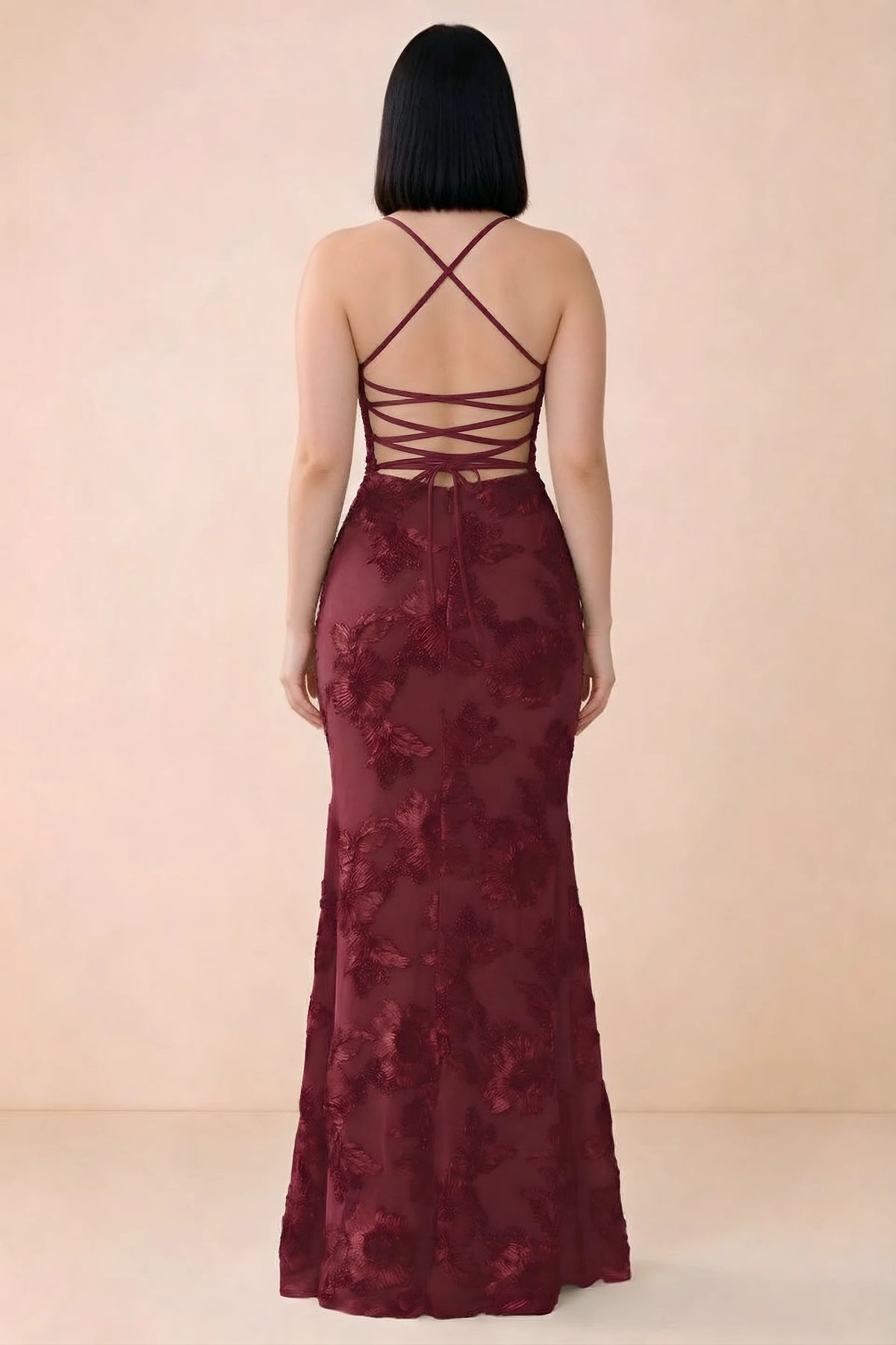 Rear studio view of Belinda burgundy dress showing the open back and gently flared skirt