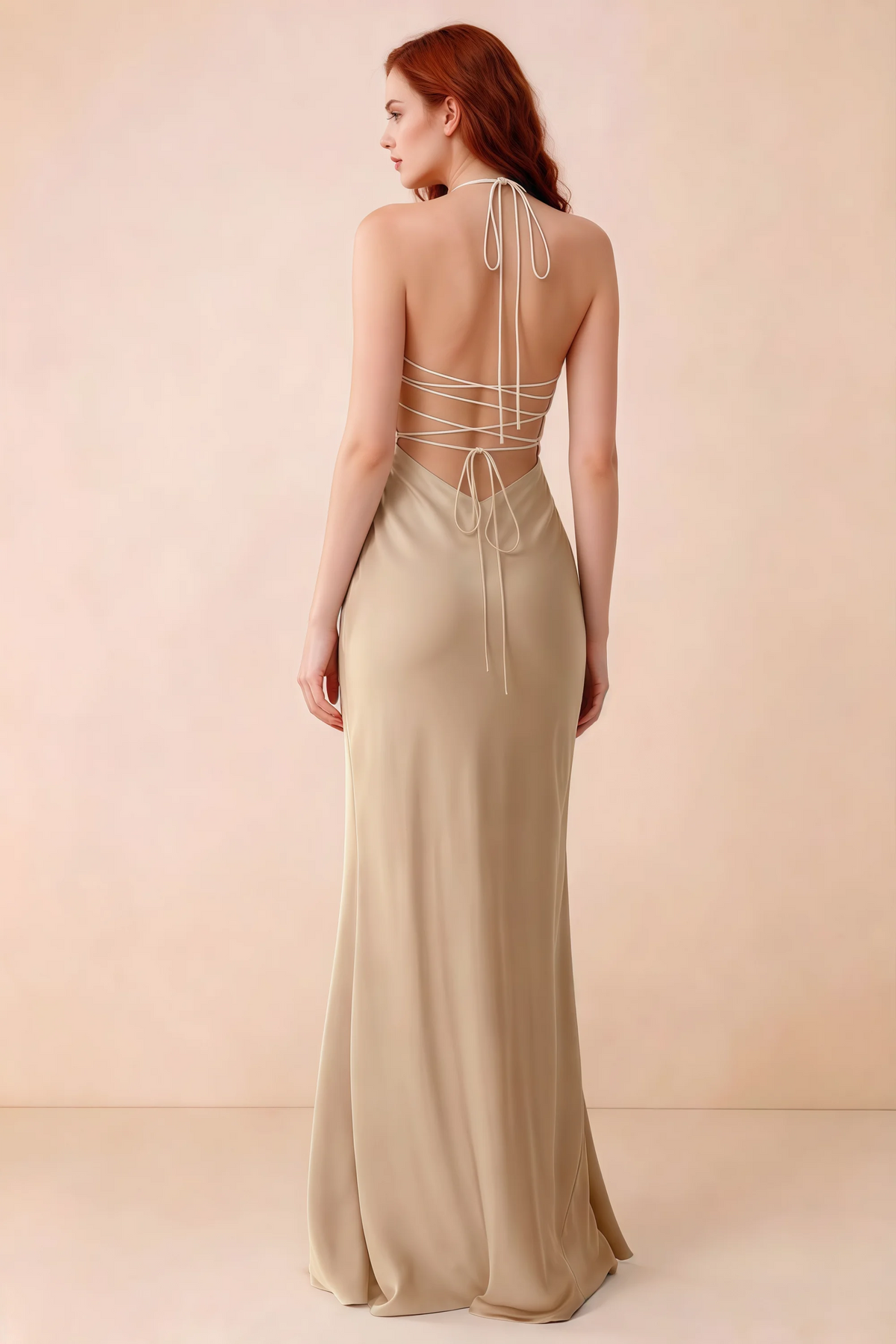 Back studio view of Blanche champagne dress showing halter neck ties and crossed open-back lacing